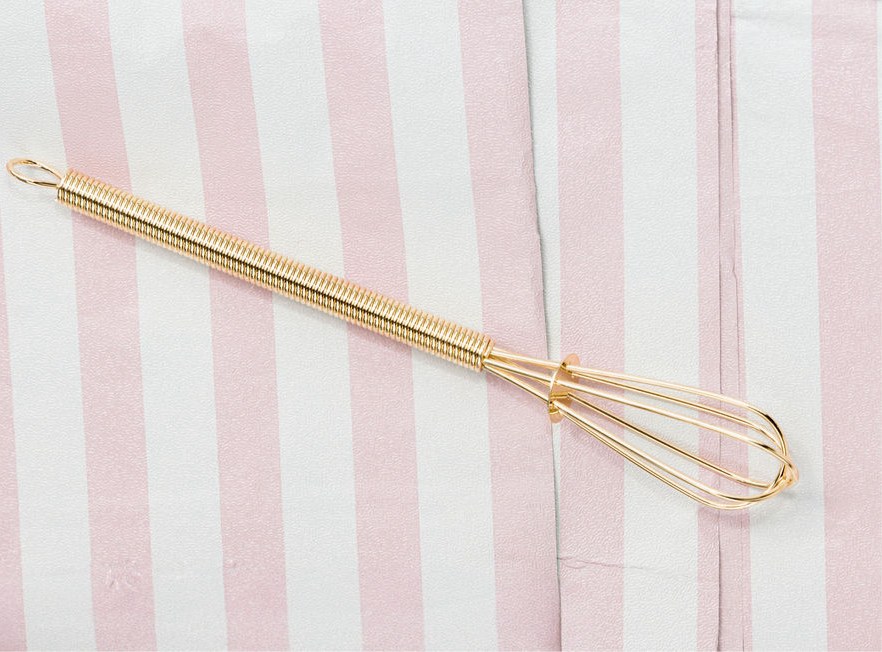 Pretty little gold whisk